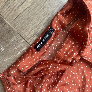 PRETTY LITTLE THING | dark orange & white polka dot satin skirt